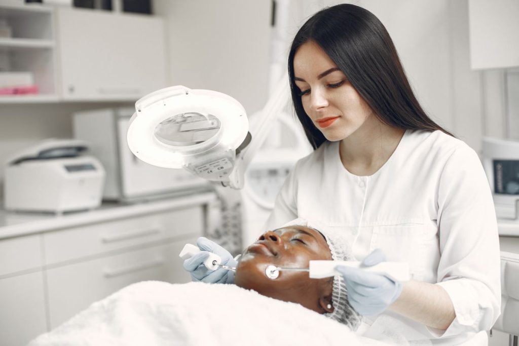 Skin lesion treatment under a magnifying lamp